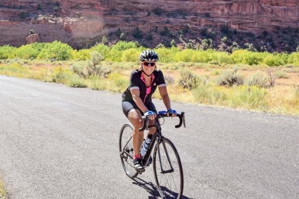 Woman cyclist in Red Rock area