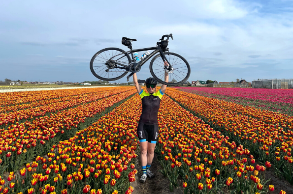 Cyclist with tulips in Keukenhof gardens