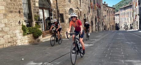 Riders through Italian village on Ride Across Italy bike tour