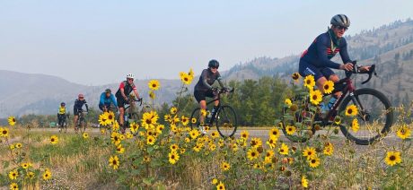 Riders and flowers on Portland to Missoula Cross Country bike tour