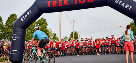 Large group of cyclists at the start line at the Trek 100