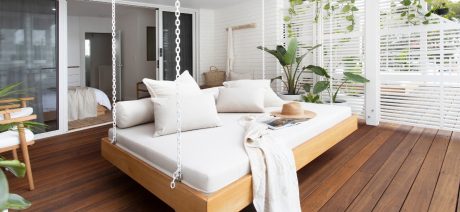 Hotel room and terrace with hanging bed and wooden flooring
