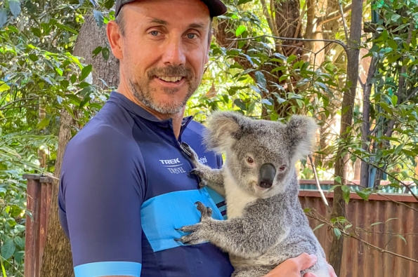 Trek Travel guide Nick holding Kiki, the Koala